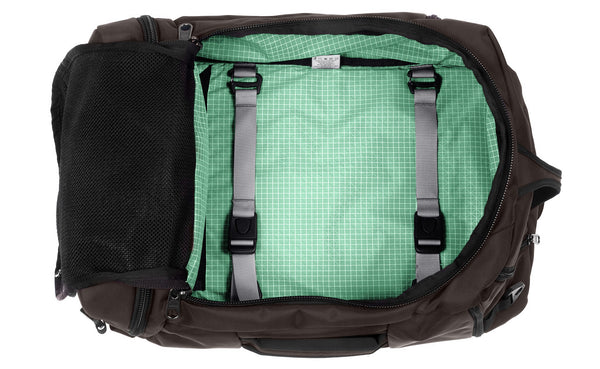 An open Techonaut 45 with a Ursa (brown) exterior and a Seafoam (pale green) interior.
